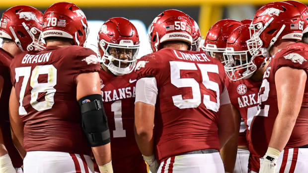 Razorbacks' offensive line huddling in fourth quarter against BYU